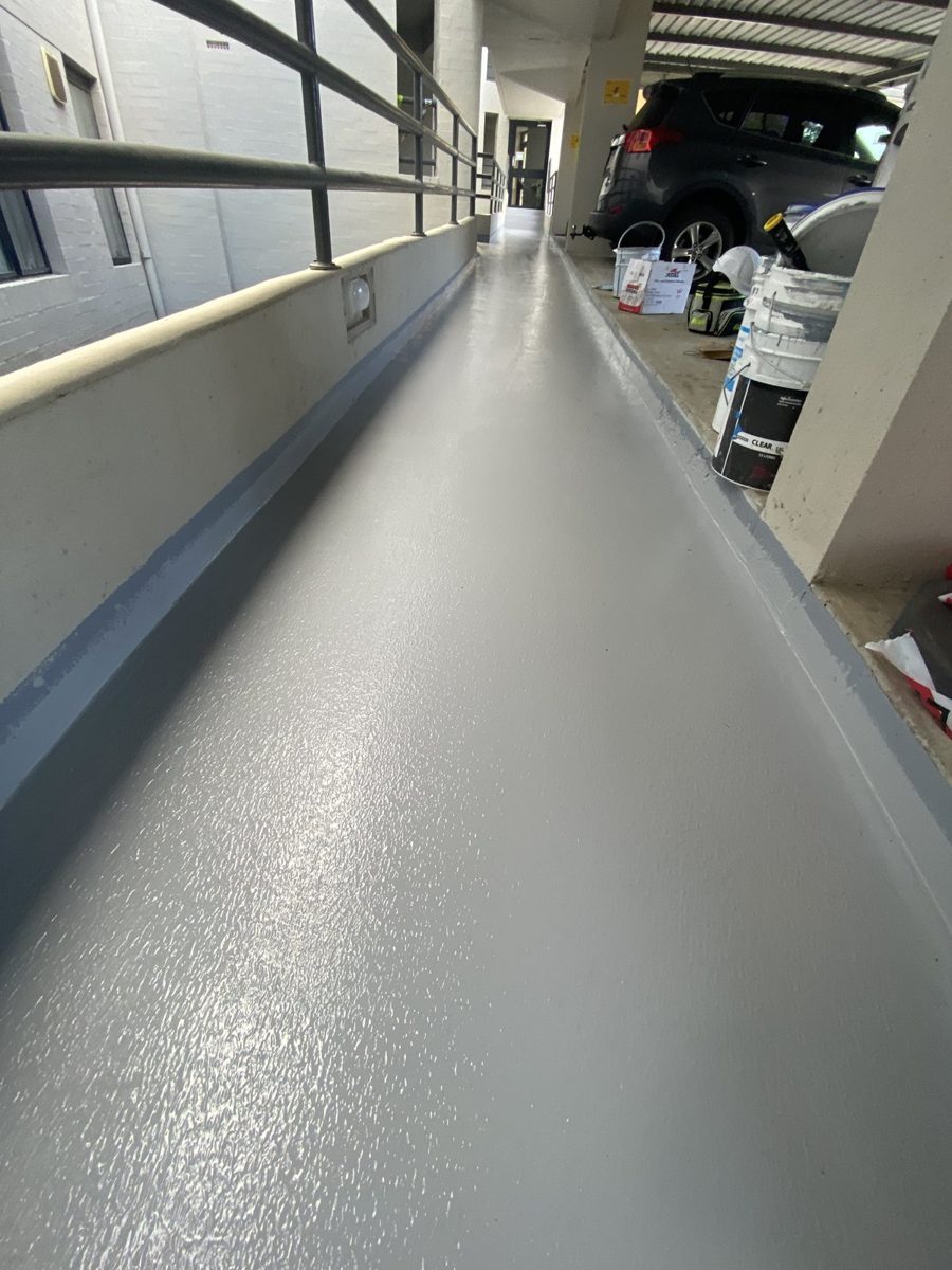 Completed waterproofing membrane on common walkway at 2 Goderich Street