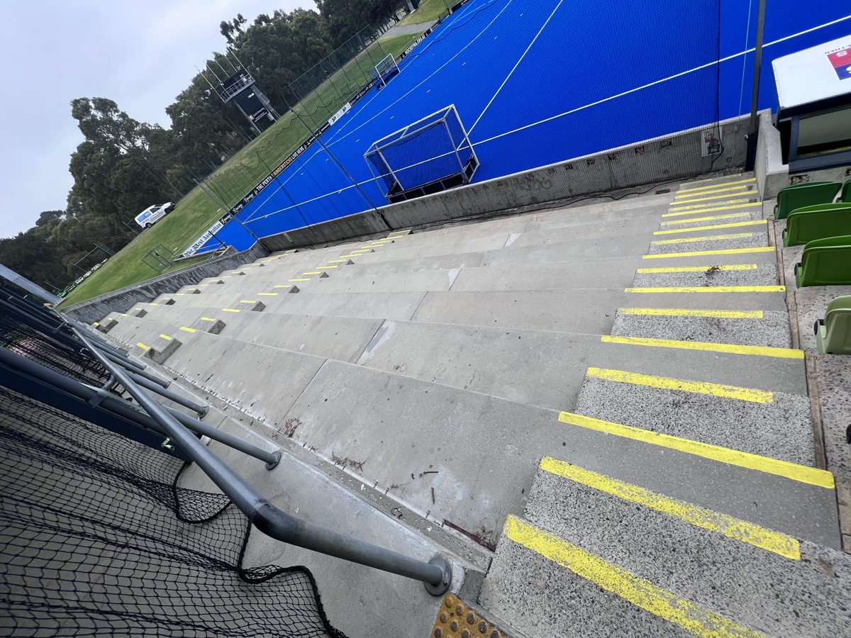 WA Hockey Stadium grandstand before waterproofing — bare concrete substrate